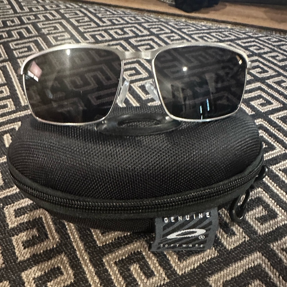 Oakley Conductor 8 sunglasses featuring Sleek Silver frame…polarized lenses.